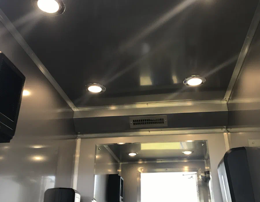 Inside the trailer: recessed ceiling lights over the mirror and vanity